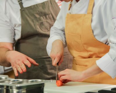 Kitchen staff preparing food together